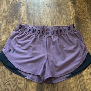 Underarmour athletic shorts that are purple and black